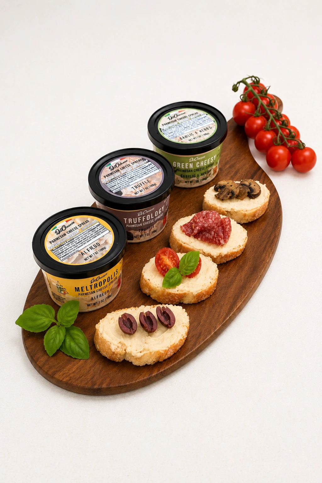 Wooden board with DeCheeso cheese spreads and appetizers on a white background