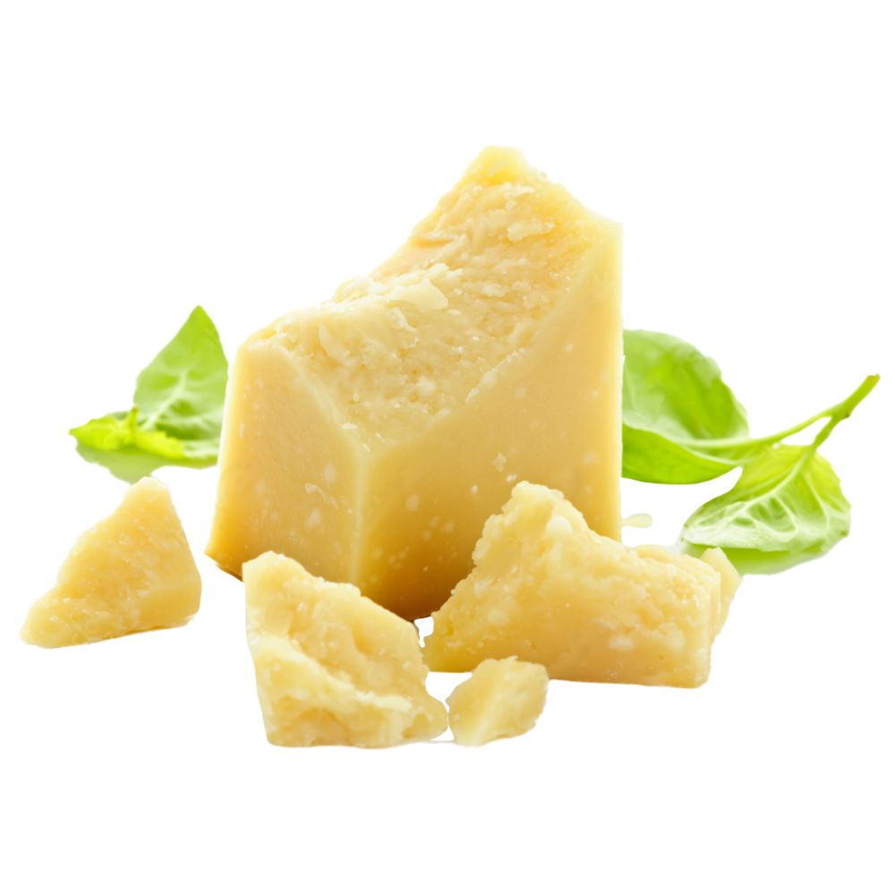 A piece of cheese garnished with fresh green leaves, showcasing a simple yet elegant presentation.